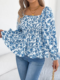 Women's floral blouse with a square neckline and flounce sleeves, featuring a light, airy fabric and a delicate floral pattern.