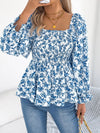 Women's floral blouse with a square neckline and flounce sleeves, featuring a light, airy fabric and a delicate floral pattern.