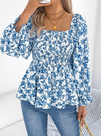 Women's floral blouse with a square neckline and flounce sleeves, featuring a light, airy fabric and a delicate floral pattern.
